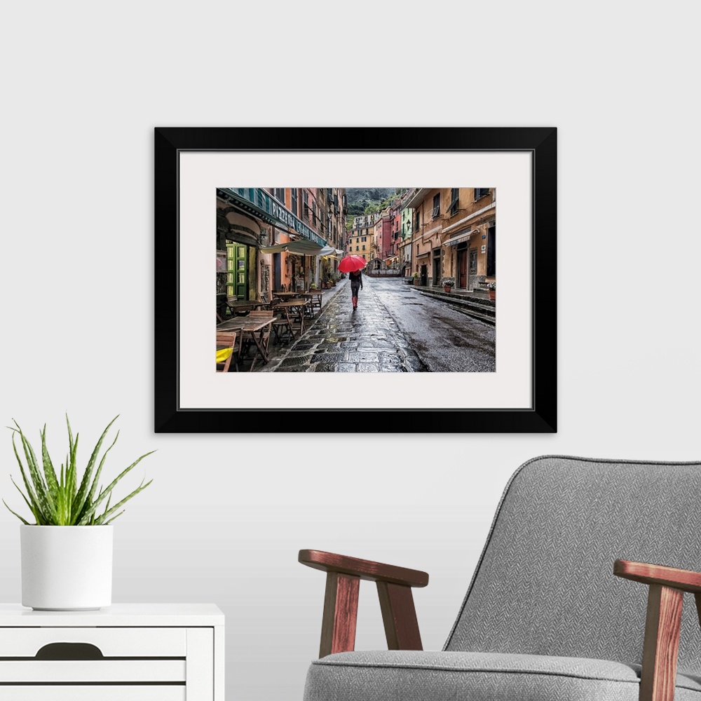 A modern room featuring Woman with red umbrella in the rain in Vernazza, Italy
