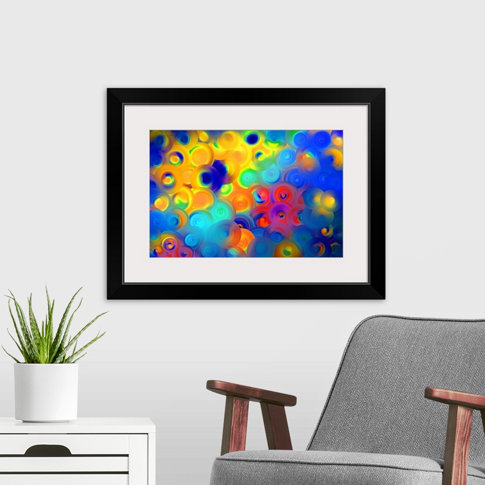 A modern room featuring Abstract artwork of overlapping swirling circles in vibrant yellow, red, and blue.