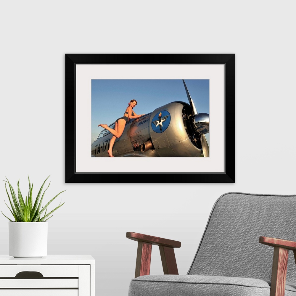 A modern room featuring 1940's style pin-up girl standing on the wing of a World War II T-6 Texan.