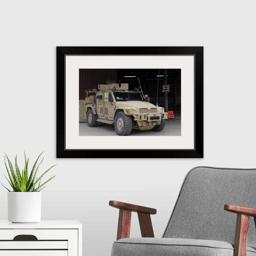A modern room featuring A Husky TSV armored vehicle of the British Army.