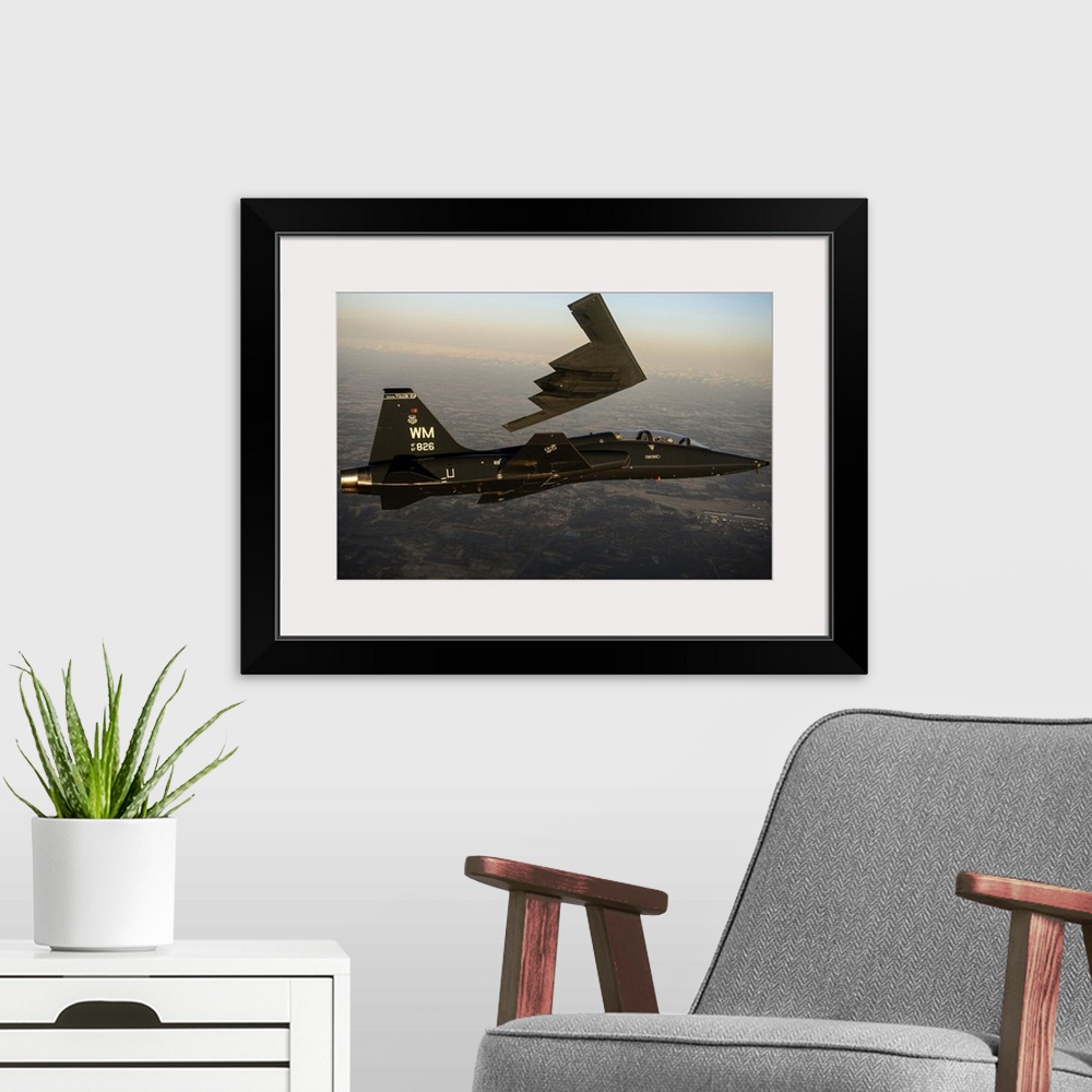 A modern room featuring February 20, 2014 - A T-38 Talon flies in formation with the B-2 Spirit of South Carolina during ...