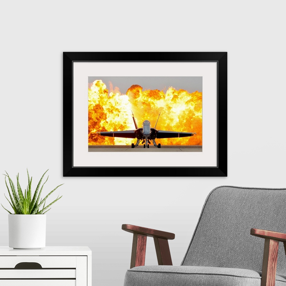 A modern room featuring This is wall art of a photograph dramatically showcasing the aerial prowess of the armed forces a...