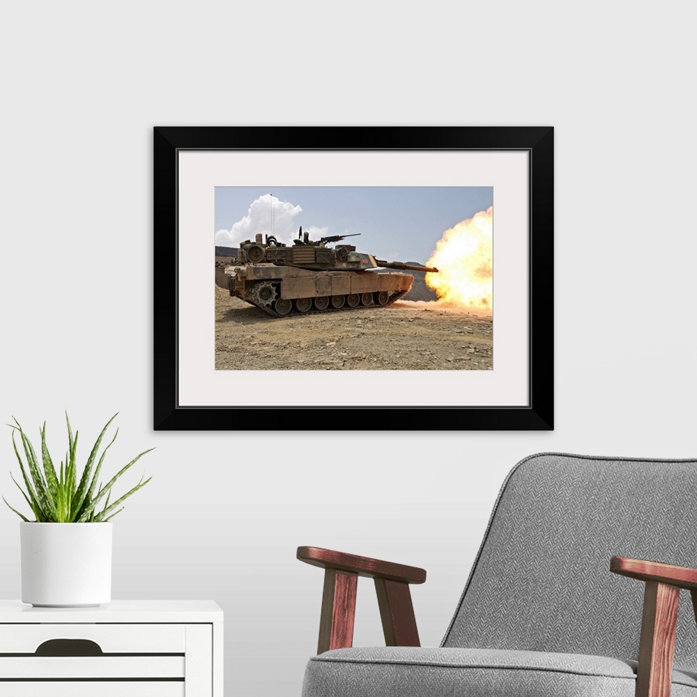 A modern room featuring March 30, 2010 - Marines bombard through a live fire range using M1A1 Abrams tanks alongside the ...