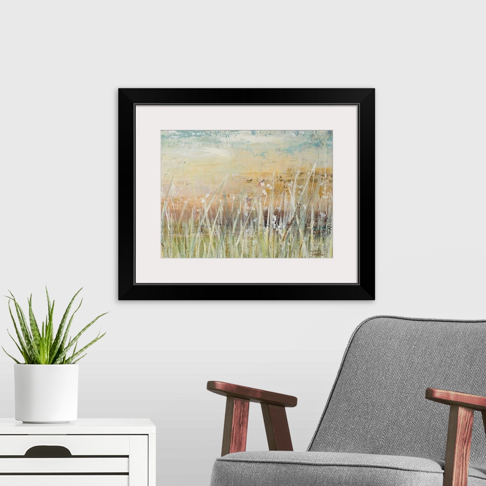 A modern room featuring A contemporary landscape painting with pale colors and white, tall grass in the foreground.