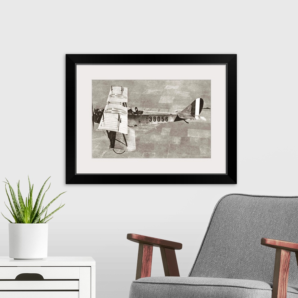 A modern room featuring American aviator flying a biplane bomber over Ellington Field, Texas. Photograph, c1917.