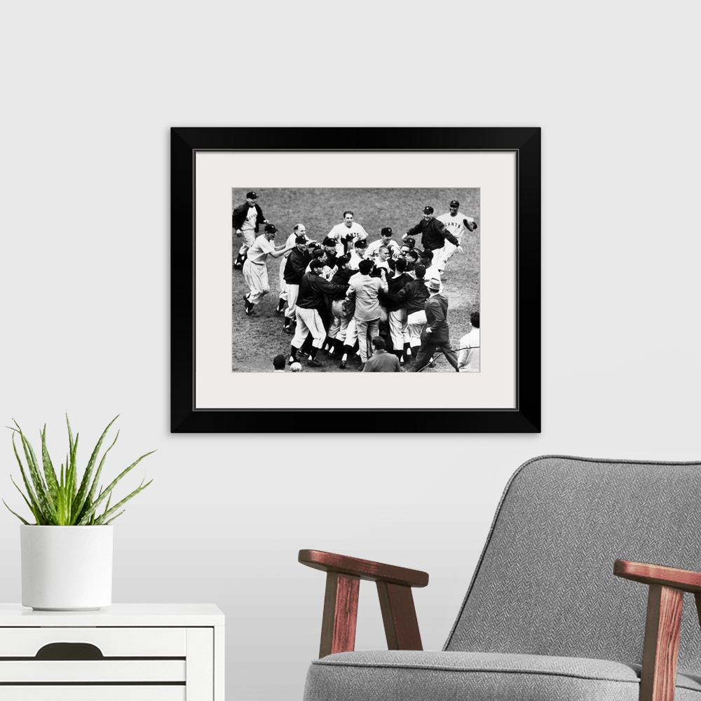 A modern room featuring Bobby Thomson of the New York Giants being mobbed by teammates and fans after hitting his pennant...