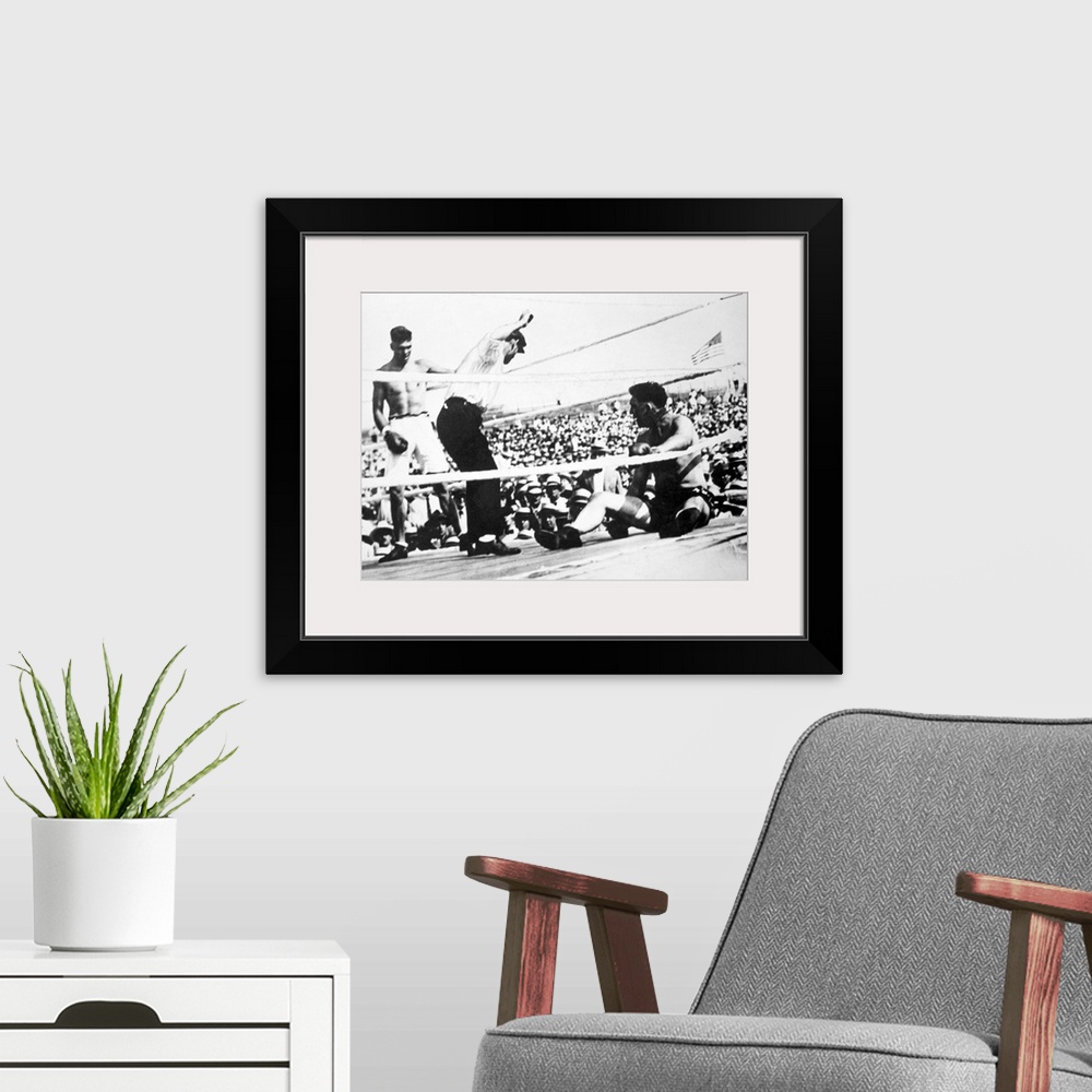 A modern room featuring American boxer. Jack Dempsey (left) winning the heavyweight championship from Jess Willard on 4 J...