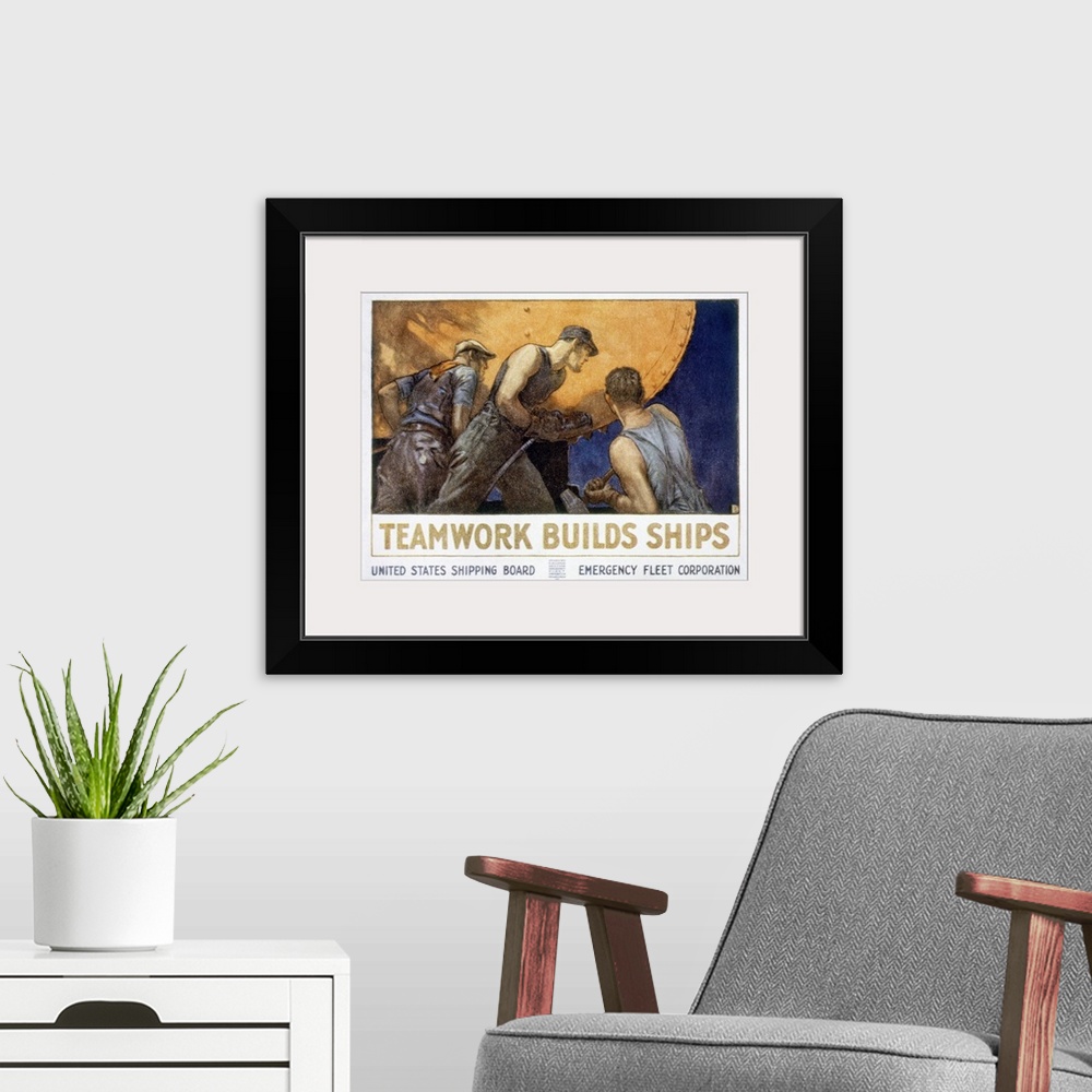 A modern room featuring 'Teamwork builds ships.' American World War I United States Shipping Board poster.