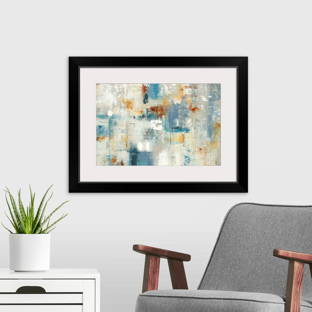 A modern room featuring Large abstract painting with shades of blue, yellow, orange, gray, and white.