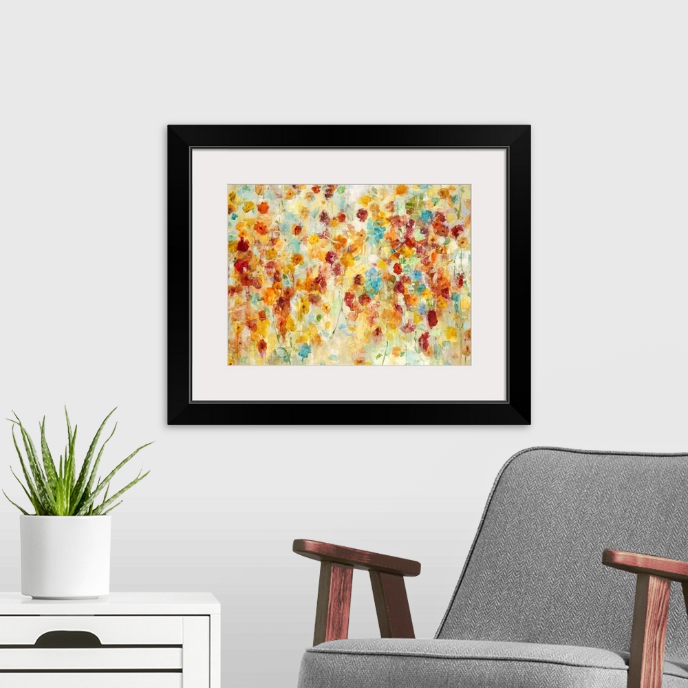 A modern room featuring A contemporary abstract flower painting using warm red orange and red tones.