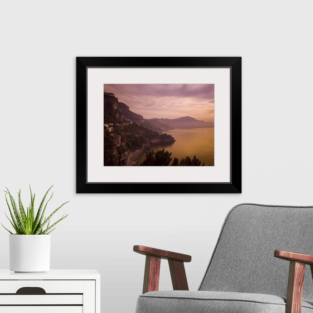 A modern room featuring A beautiful sunset turns this view of the Amalfi Coast purple and orange