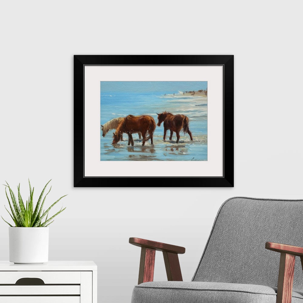 A modern room featuring A painting of horses on a beach wading through shallow water.
