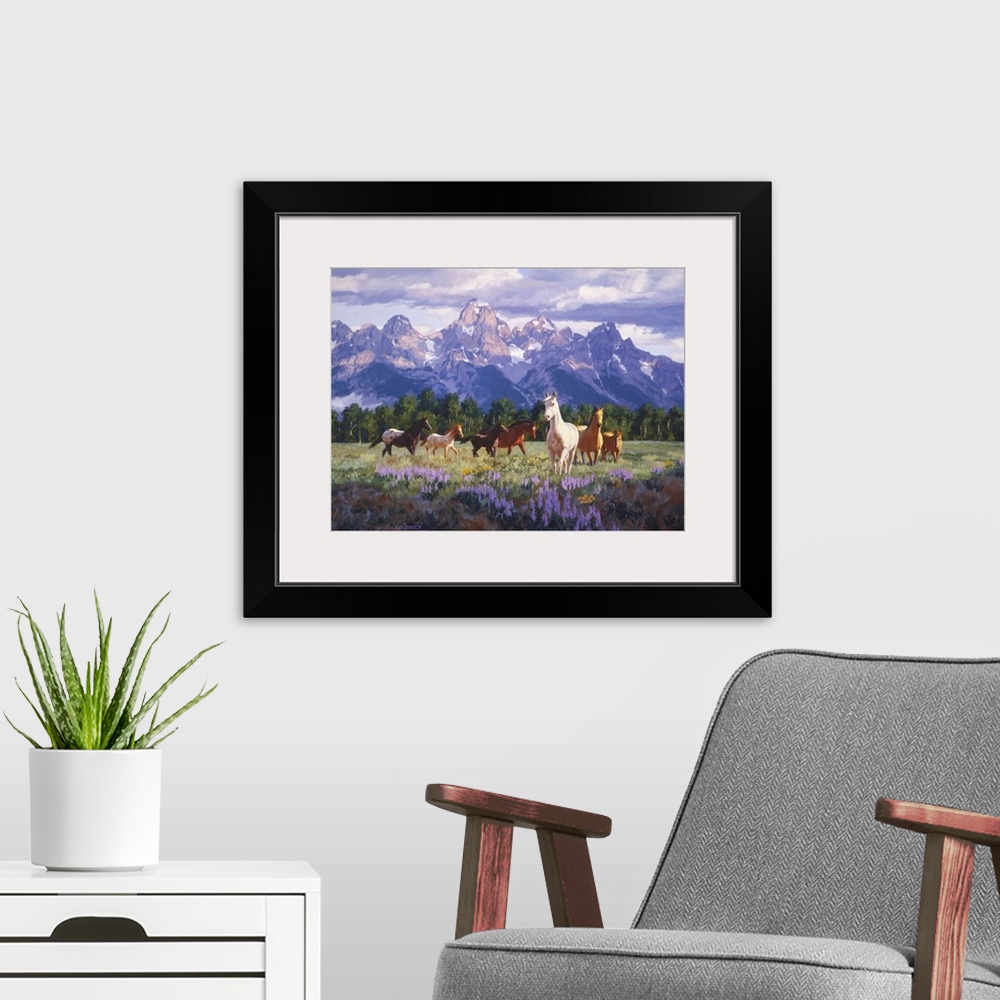 A modern room featuring Contemporary colorful painting of a herd of horses in a countryside clearing, with mountains in t...