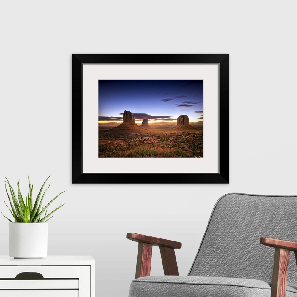 A modern room featuring Beautiful photograph of the canyons in Monument Valley, AZ at sunset.