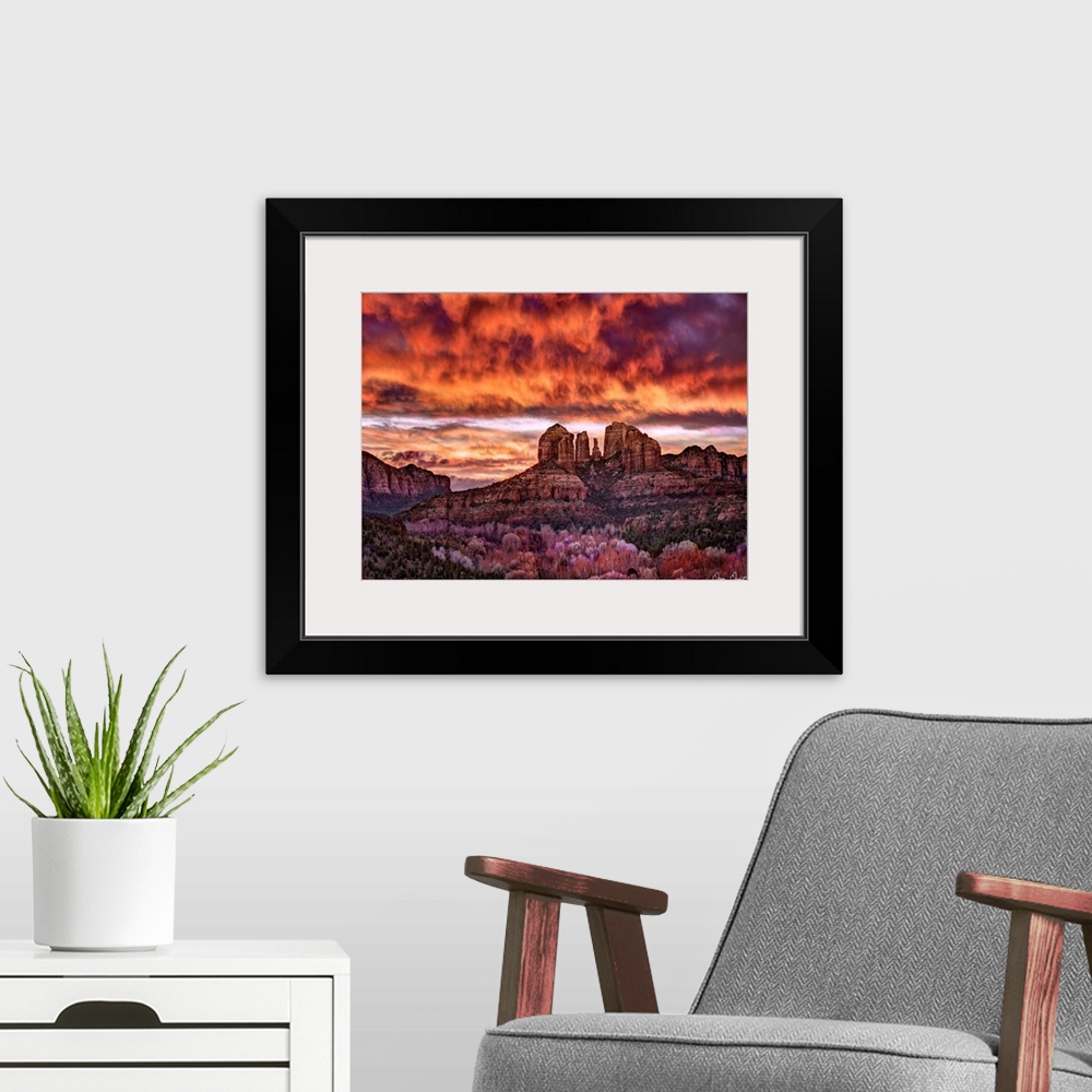 A modern room featuring High definition photograph of sandstone canyons with a fire sky above.