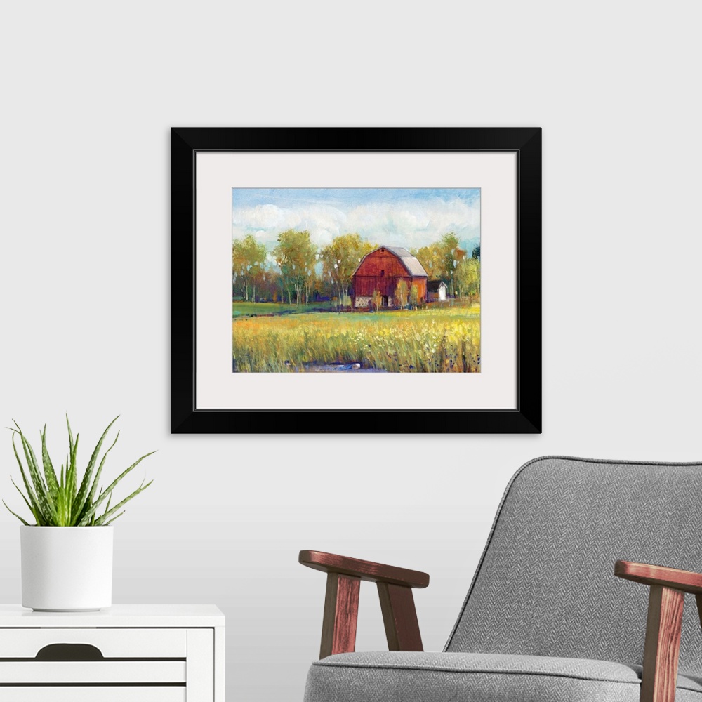 A modern room featuring Colorful rural landscape featuring a red barn surrounded by lush, green vegetation.