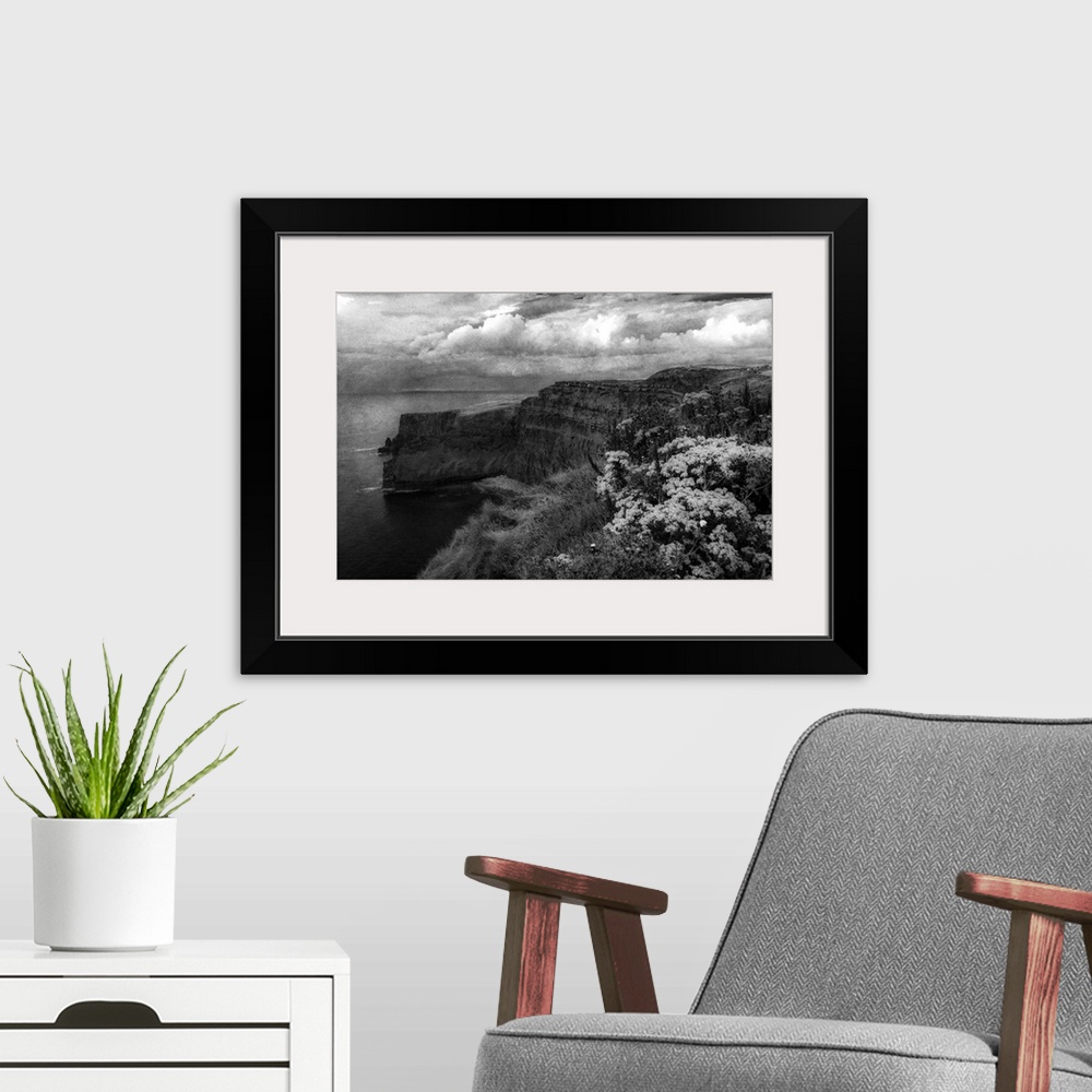 A modern room featuring Fine art photo of cliffs on the Irish coast under a stormy sky.