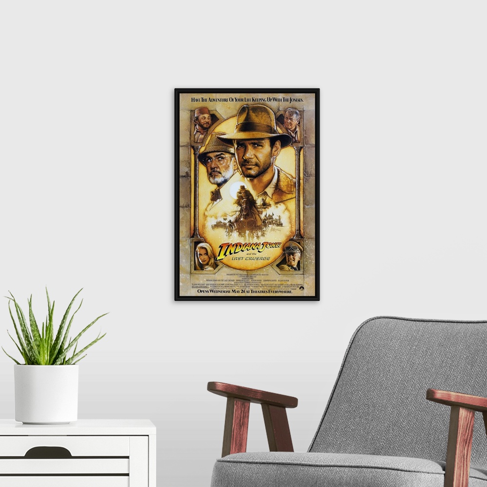 A modern room featuring Movie poster advertising the 1989 classic family favorite movie, Indiana Jones and the Last Crusa...
