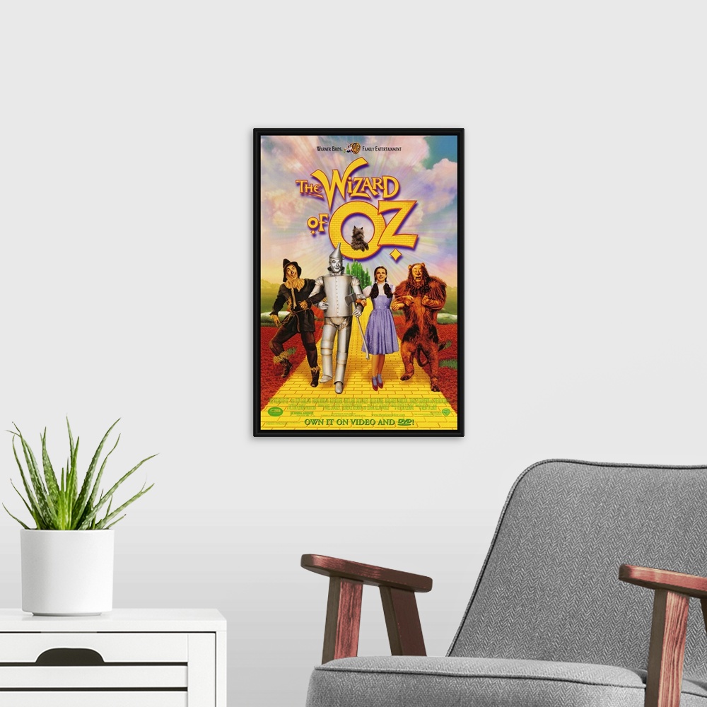 A modern room featuring Wall art of a classic movie with the Scarecrow, Tin man, Dorothy and the Cowardly Lion walking do...