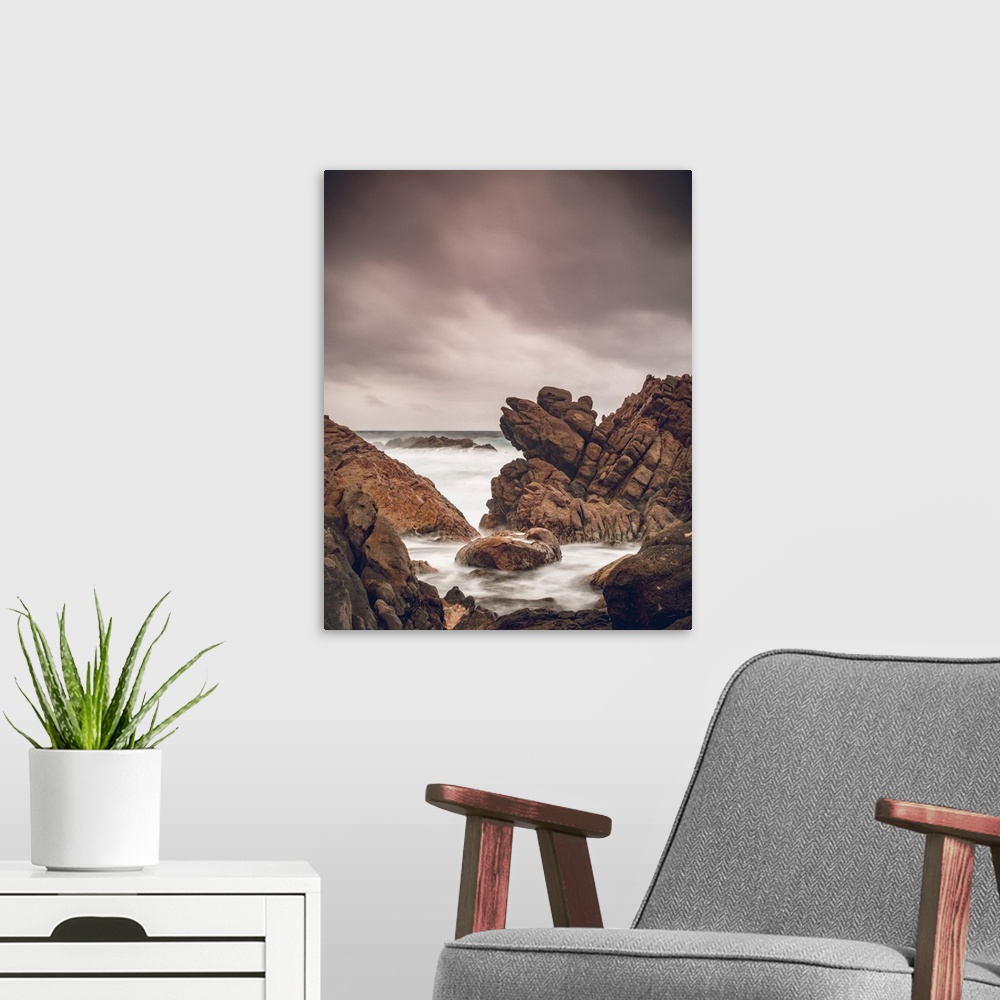 A modern room featuring Canal rocks along the coast of the Indian Ocean under a cloudy sky; Yallingup, Western Australia,...
