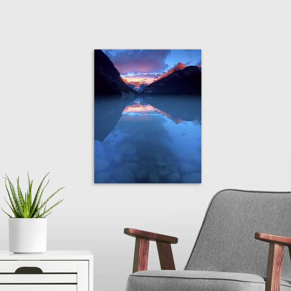 A modern room featuring Canada, Alberta, Banff National Park. Sunrise reflects Victoria Glacier on Lake Louise. Credit as...