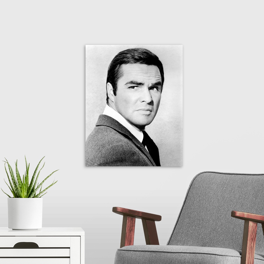 A modern room featuring Vintage black and white photograph of TV actor Burt Reynolds.