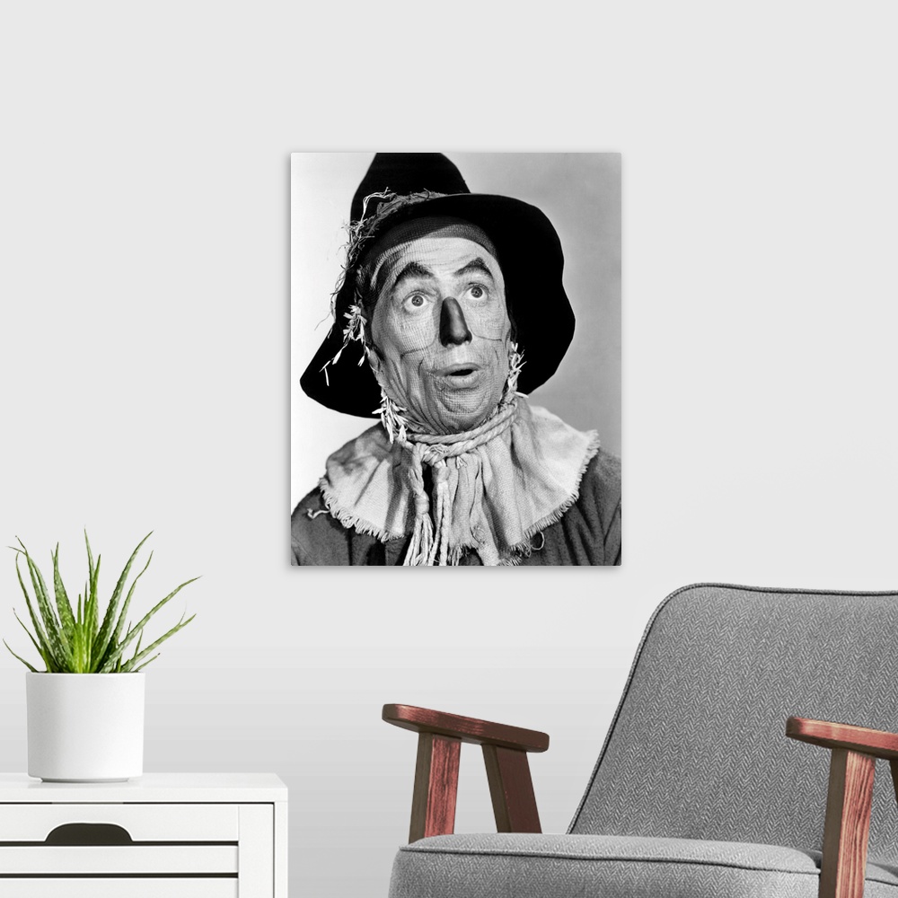 A modern room featuring THE WIZARD OF OZ, Ray Bolger in costume as the Scarecrow, 1939.