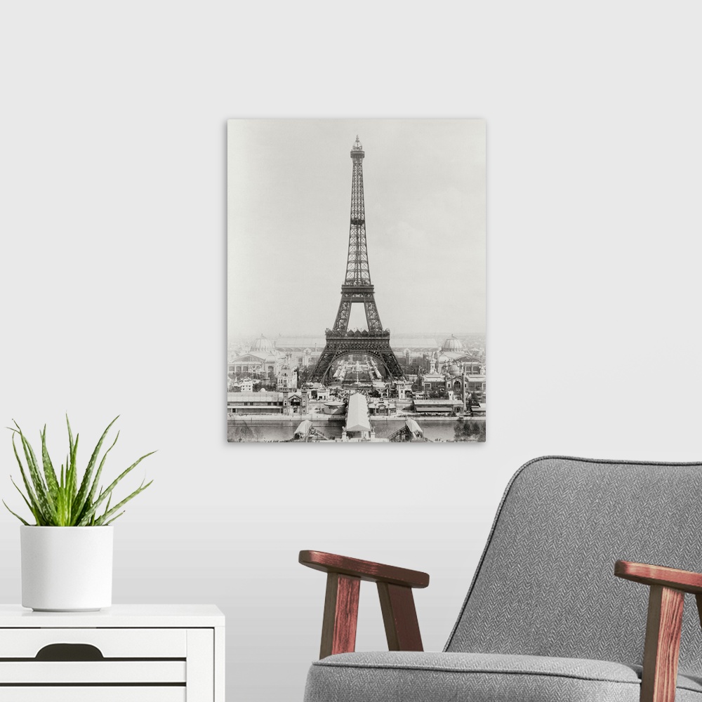 A modern room featuring Vintage black and white photograph of the Eiffel Tower.