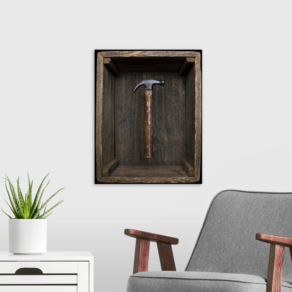 A modern room featuring Antique hammer floating in old box