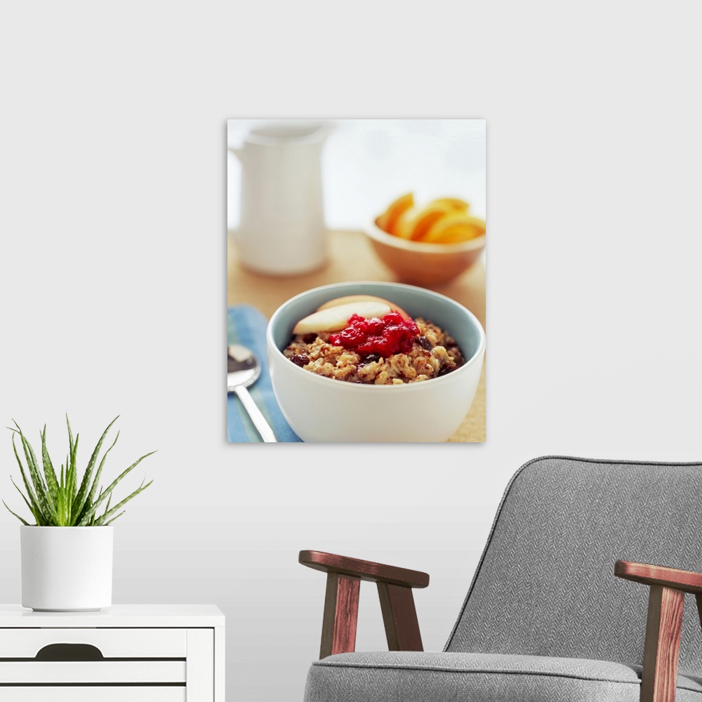 A modern room featuring Bowl of raisin, oatmeal with apples and cranberries, close-up