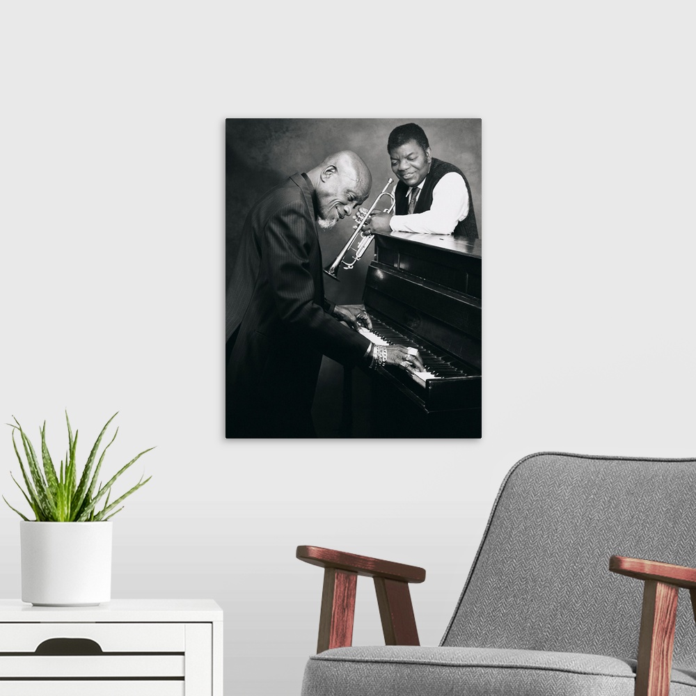 A modern room featuring Pianist and trumpet player talking together