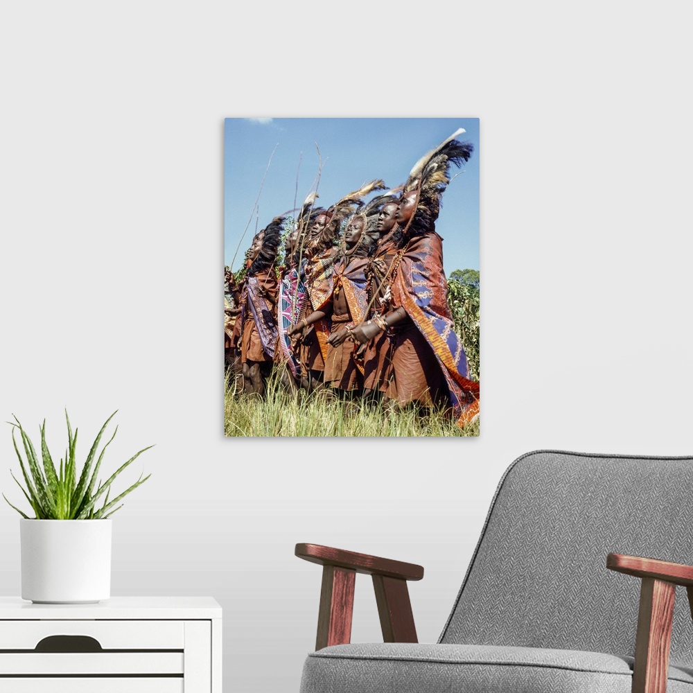 A modern room featuring Kenya, Kilgoris County,Lolgolrien. Maasai warriors dance during an eunoto ceremony.