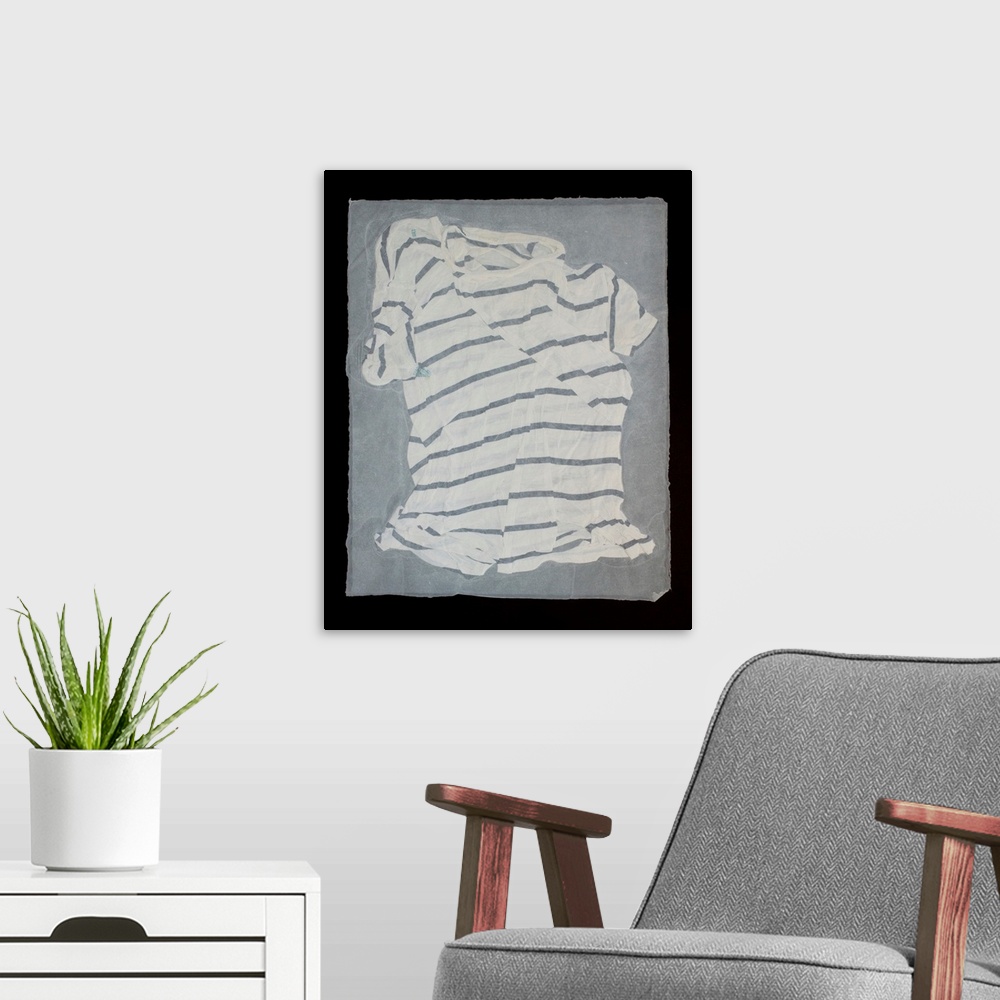 A modern room featuring A striped, torn and mended t-shirt suspended in handmade paper.