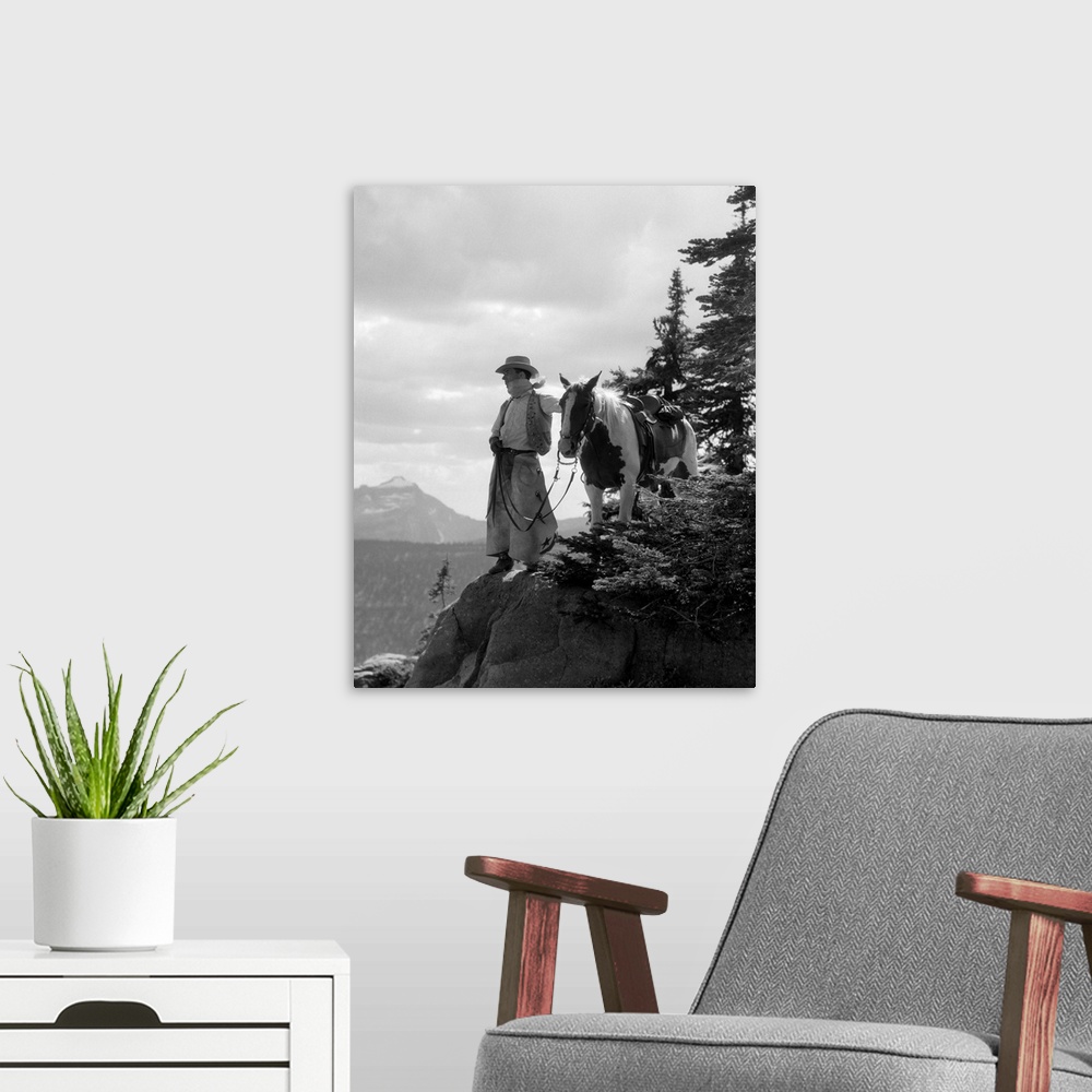A modern room featuring 1930s Man Cowboy In Chaps Vest Hat And Kerchief With Paint Horse On Peak Overlooking Glacier Park...