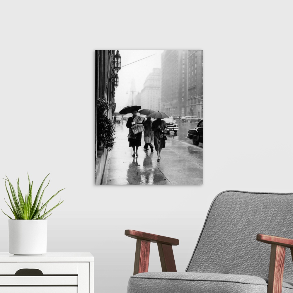 A modern room featuring 1950's Fashionable Woman Wearing Leopard Skin Muff And Stole Walking Down Rainy City Street.