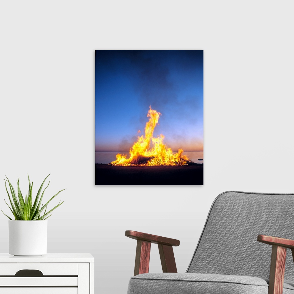 A modern room featuring Fire on the beach, gotland island, sweden.