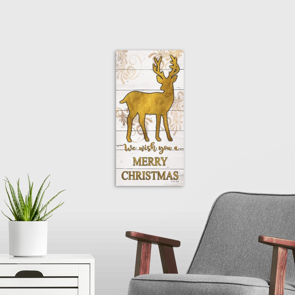 A modern room featuring The holiday sentiment, we wish you a merry Christmas, is in gold color letters underneath deer si...