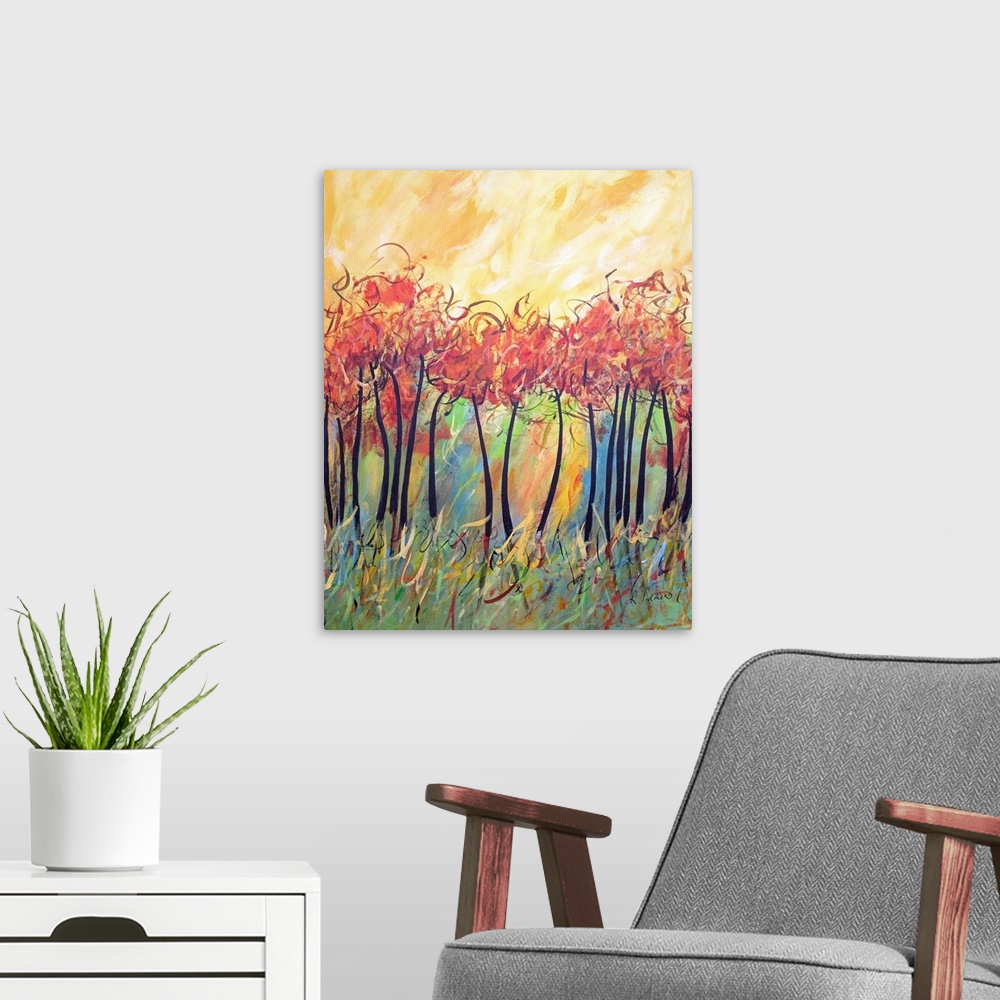 A modern room featuring Contemporary painting of a forest of thin trees with bright red foliage and a yellow sky above.