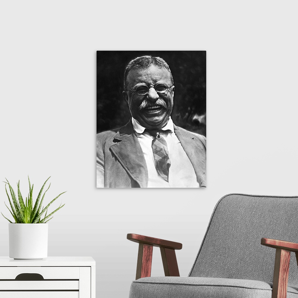 A modern room featuring Vintage portrait featuring a smiling Theodore Roosevelt, taken on May 3rd, 1921.