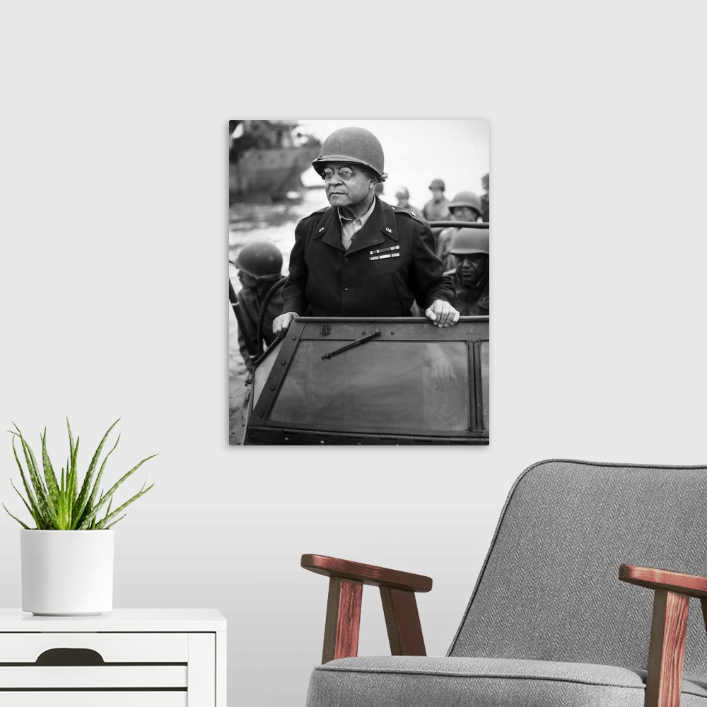 A modern room featuring World War II photograph of General Benjamin O. Davis overseeing troops in France.