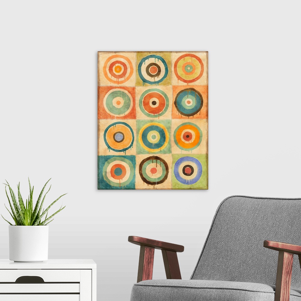 A modern room featuring Abstract geometric artwork of multicolored concentric circles.