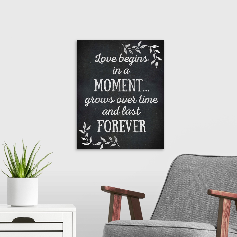 A modern room featuring Chalkboard sign that reads "Love begins in a Moment... grows over time and lasts Forever"