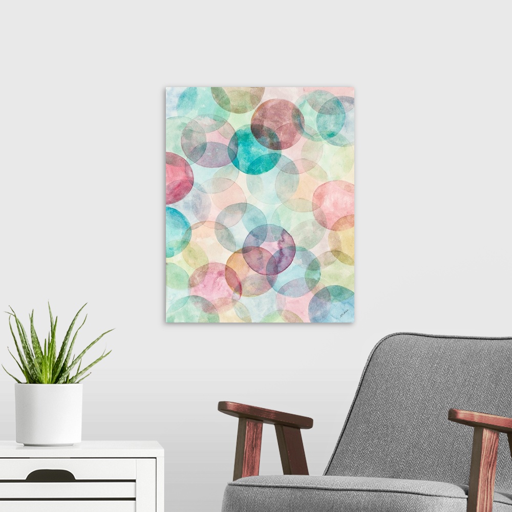 A modern room featuring A contemporary watercolor painting of colorful geometric circular shapes merging together.