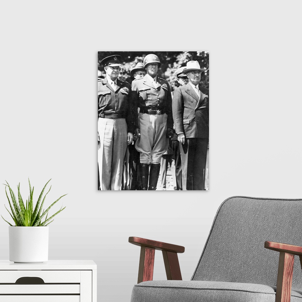A modern room featuring General Dwight D. Eisenhower, General George S. Patton, and President Harry S. Truman watching as...