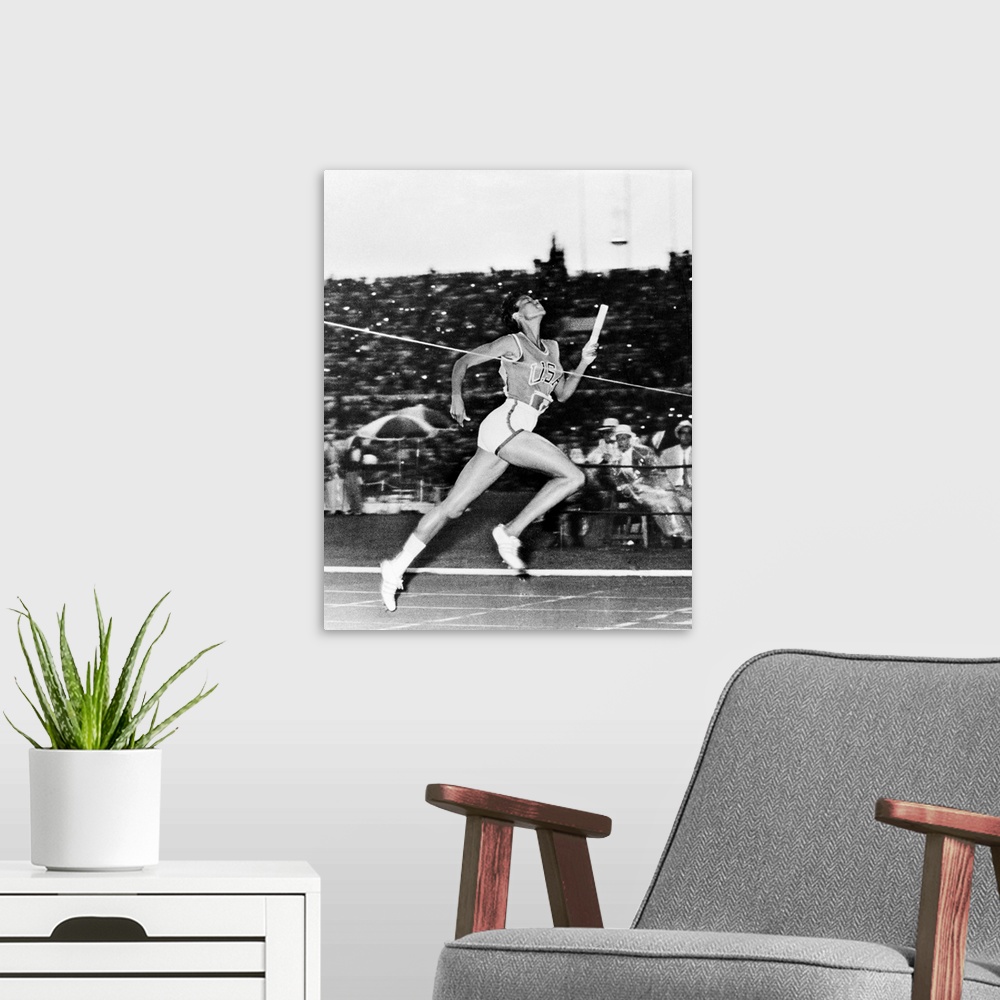 A modern room featuring American track and field athlete. Crossing the finish line to win the 400-meter relay for the Uni...