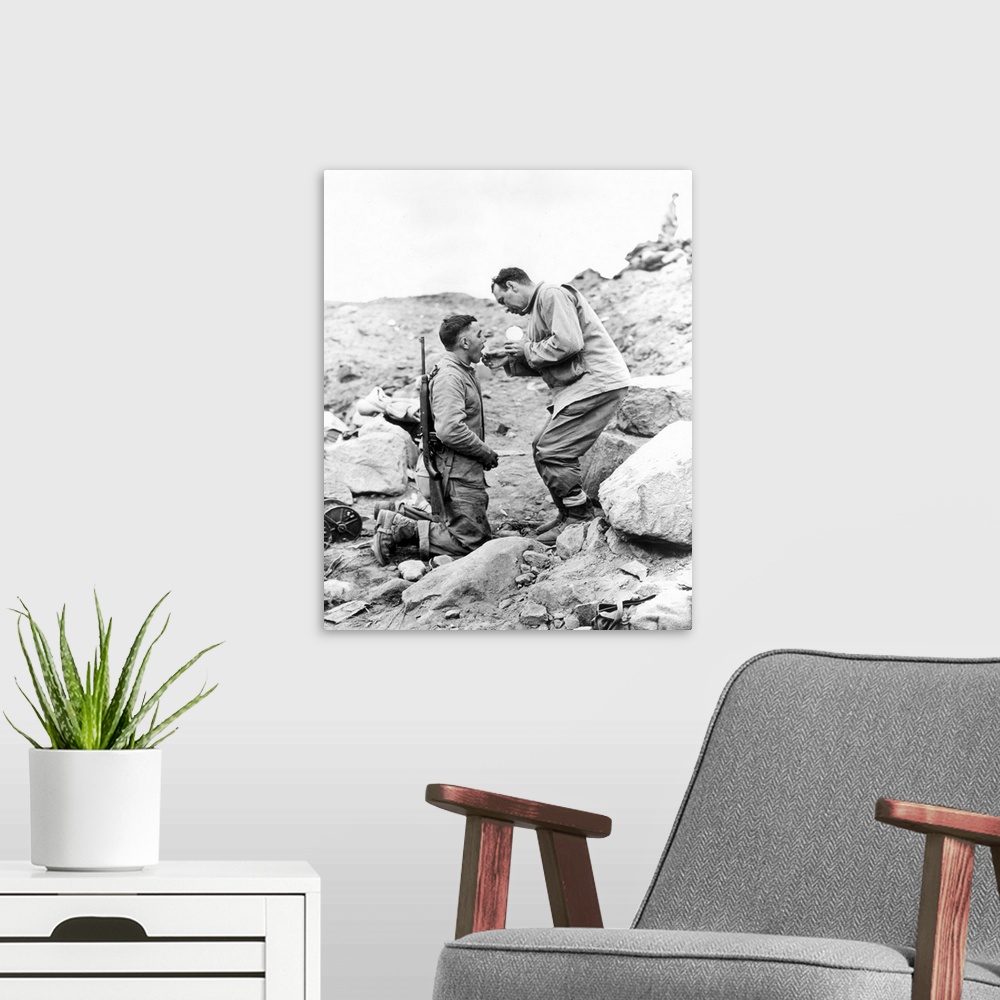 A modern room featuring An United States Marine receiving Communion on Iwo Jima, 1945.