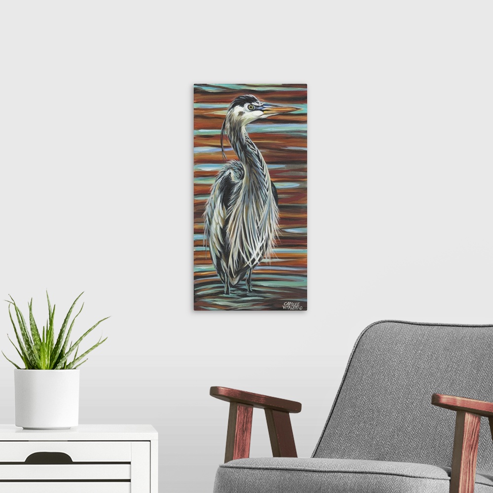 A modern room featuring Artwork of a Great Blue Heron with fluffed up feathers standing in a shallow pond.