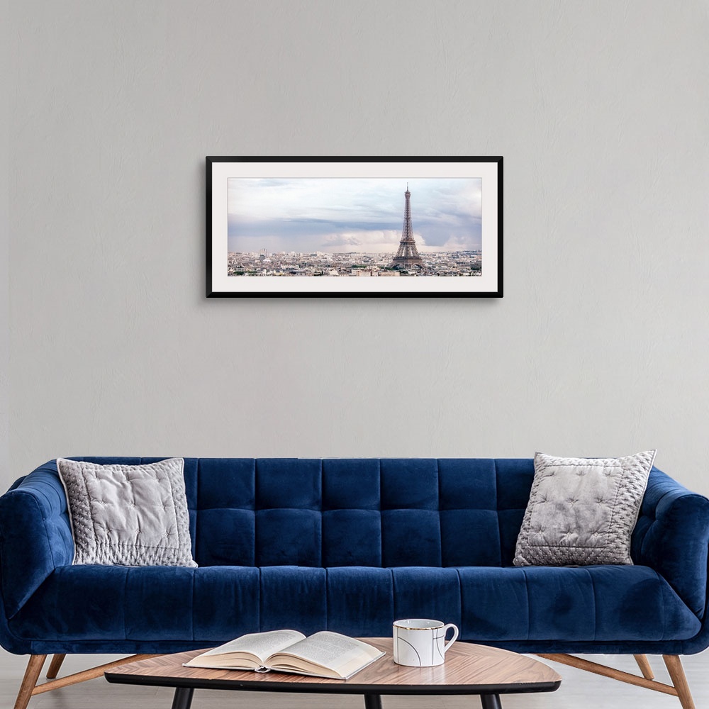 A modern room featuring Panoramic photograph of the city of Paris highlighting the Eiffel Tower.