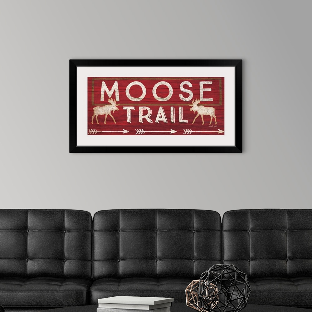 A modern room featuring Contemporary cabin decor artwork of a wooden sign for Moose Trail.