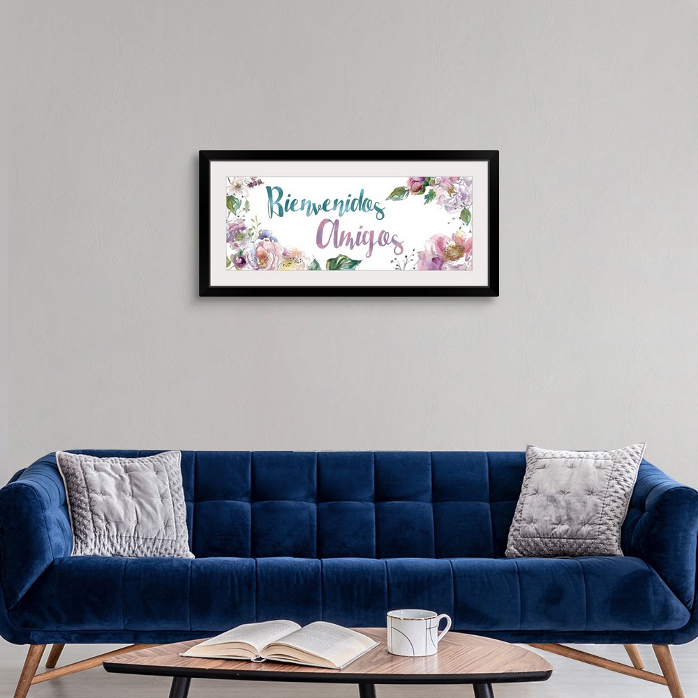 A modern room featuring The words "Bienvenidos Amigos" is delicately illuminated with assorted watercolor flowers and fol...